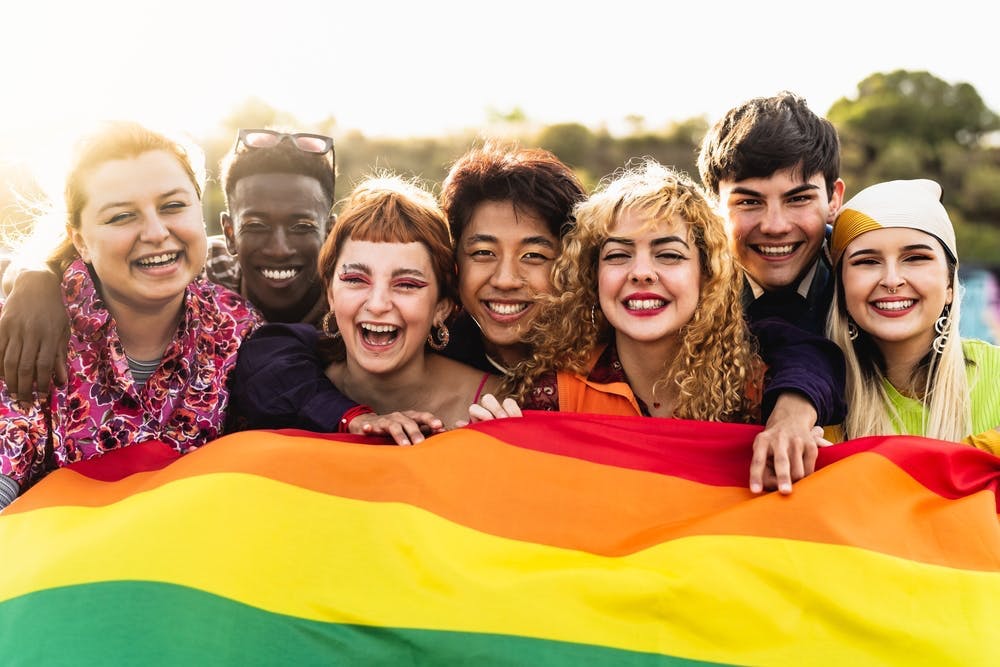 Diverse young friends celebrating gay pride 