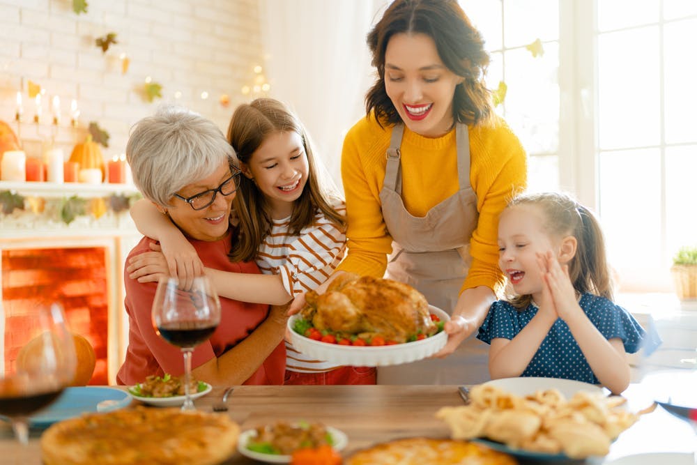A family enjoying their thanksgiving meal 