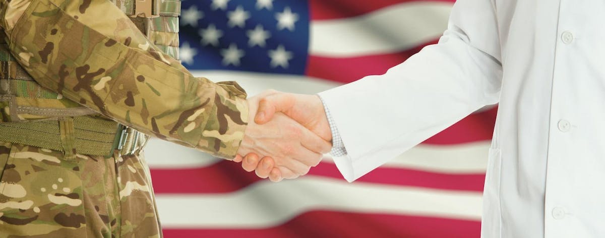 Doctor and a military officer shaking hands