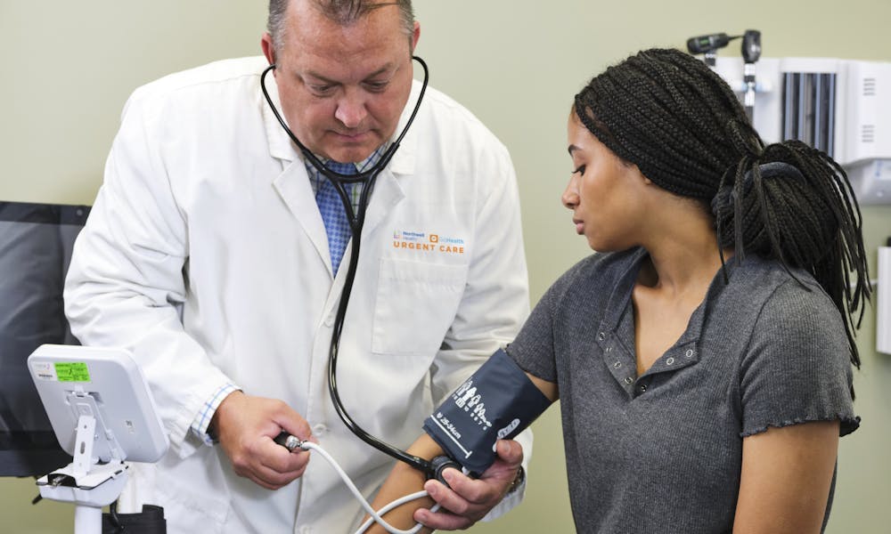 Northwell Health-GoHealth Provider checking patient's blood pressure