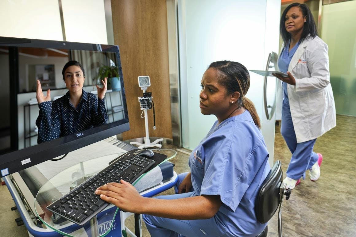 urgent care providers speaking to a patient virtually