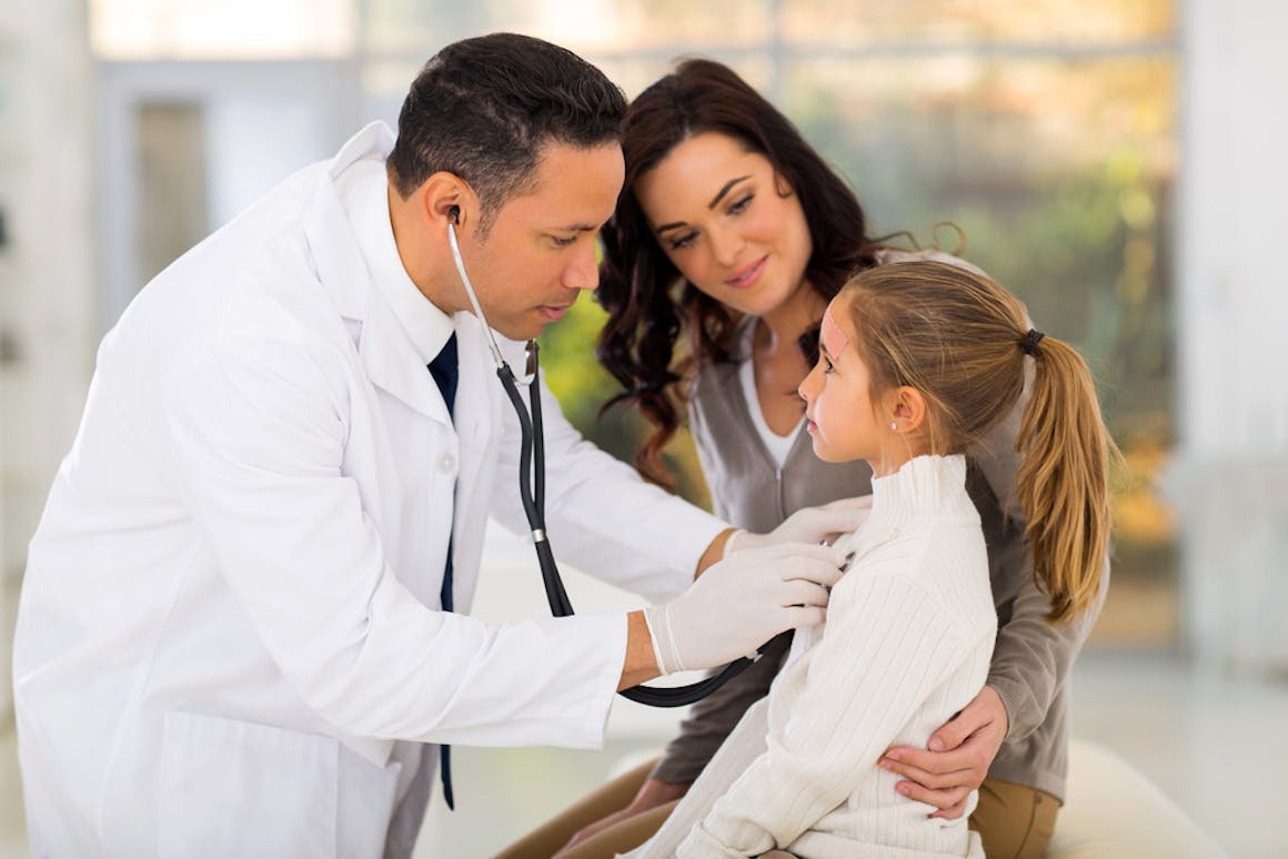 Doctor checking child