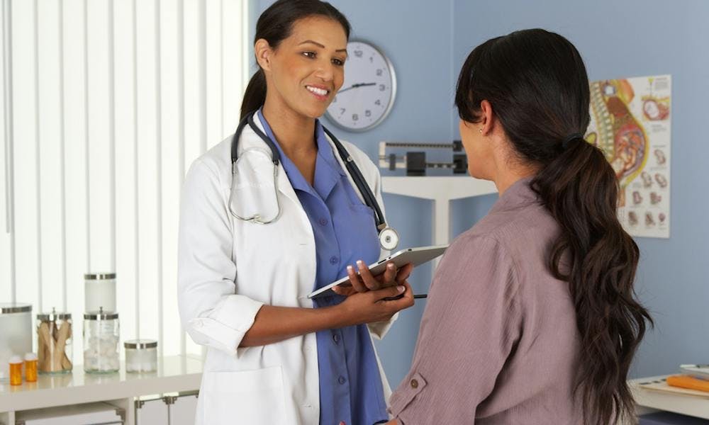 Physician talking to patient