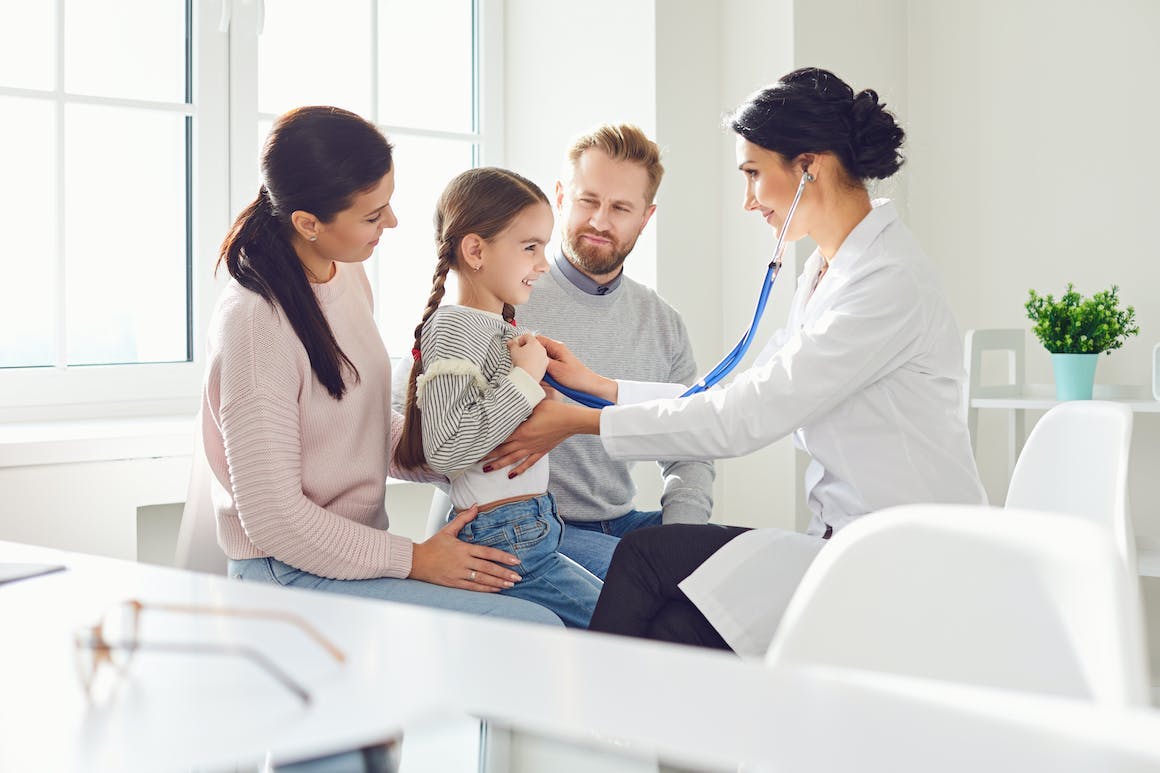 Family and child with physician